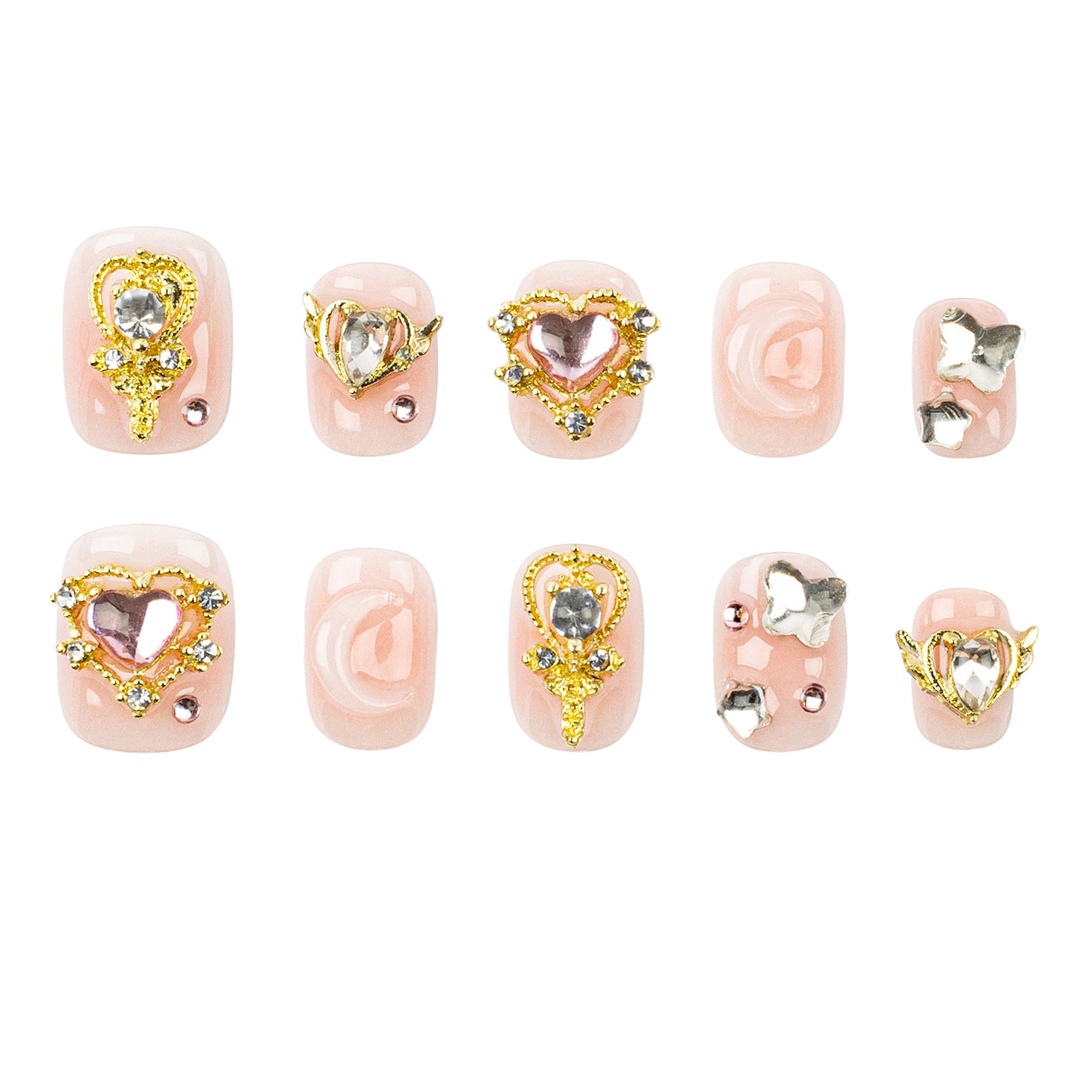Ten-piece press-on nail set featuring pastel pink artificial nails with various gold and silver rhinestone heart, wings, and moon nail art designs, displayed on a clean white background.