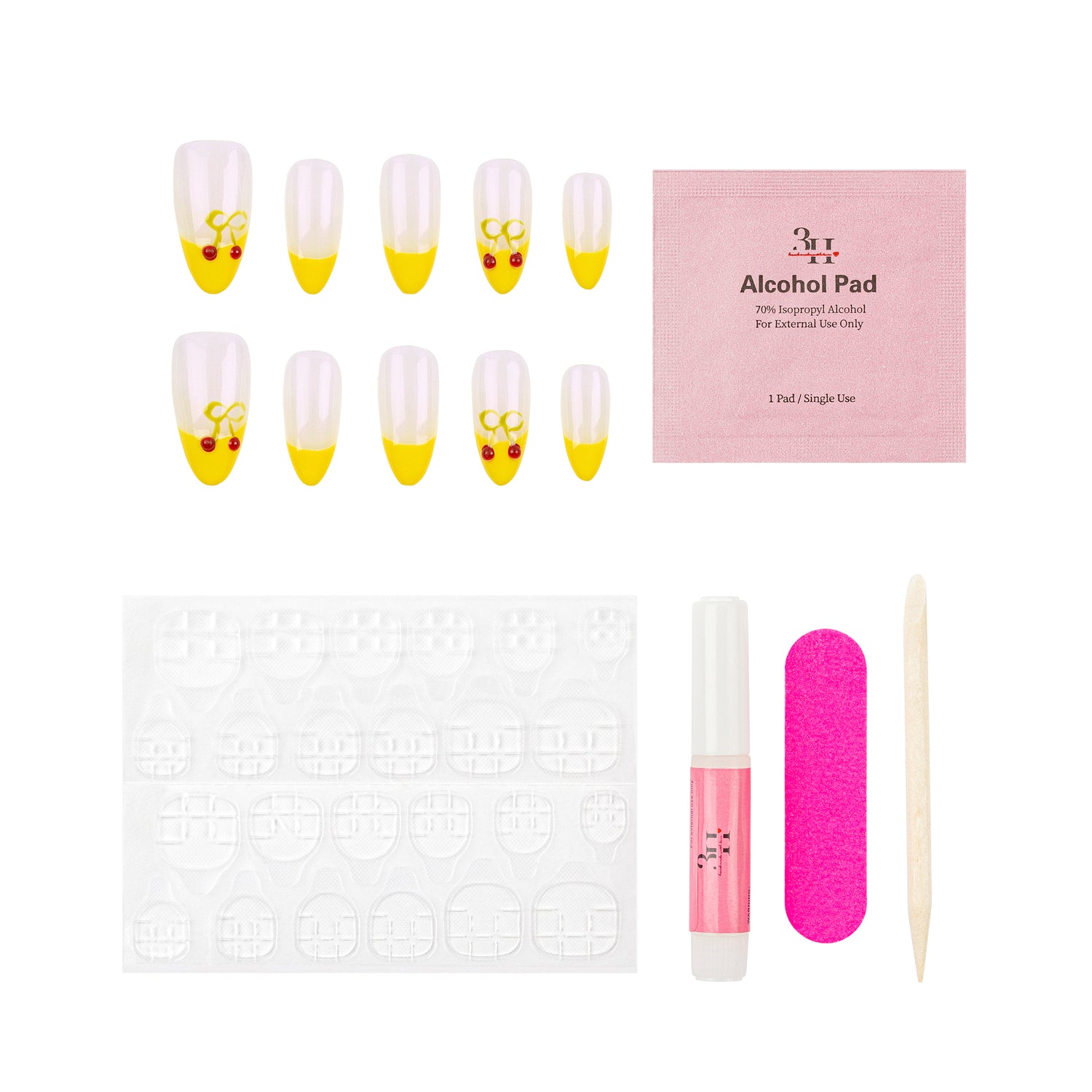 Nail art kit with 10 false nails featuring a white-to-yellow gradient and small red cherry designs, a pink packet of gel nail alcohol pads, a white nail stamping plate, a pink gel nail polish tube, a pink nail file, and a wooden cuticle stick on a white background.