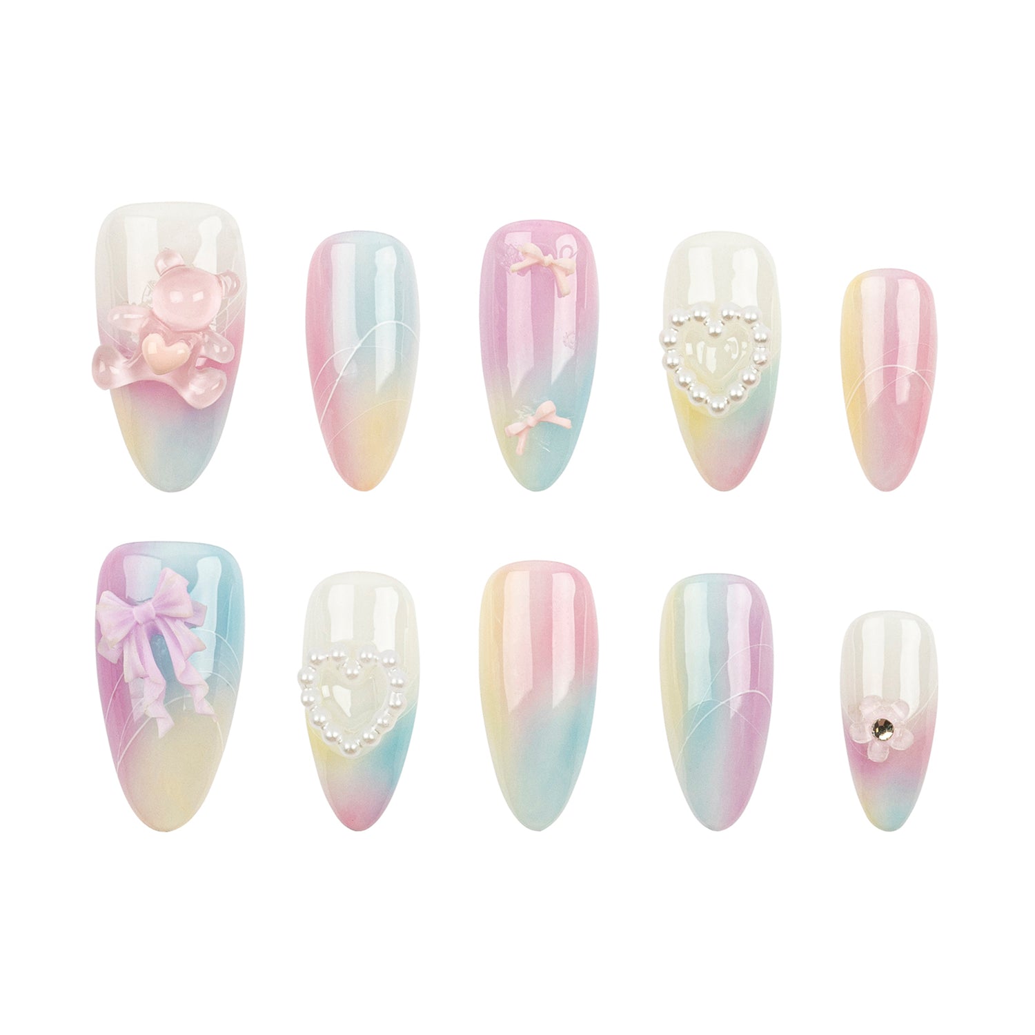 Ten-piece press-on nail set with pastel gradient designs in pink, blue, and yellow, featuring various decorative embellishments like bows, pearls, and a teddy bear on a white background.