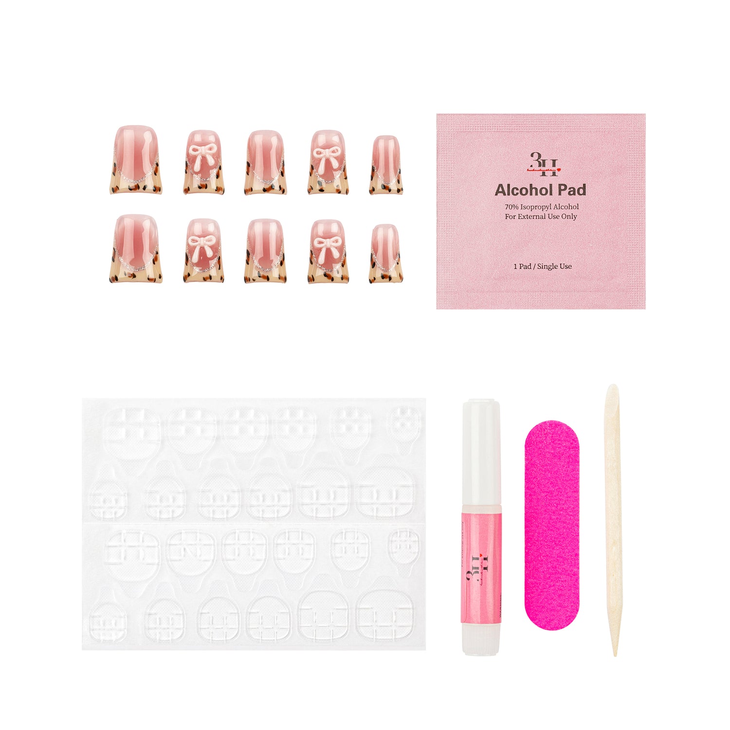 Nail art kit with pink gradient false nails, a pink packet, adhesive tabs, a pink nail file, a pink nail glue tube, and a wooden cuticle stick on a white background.