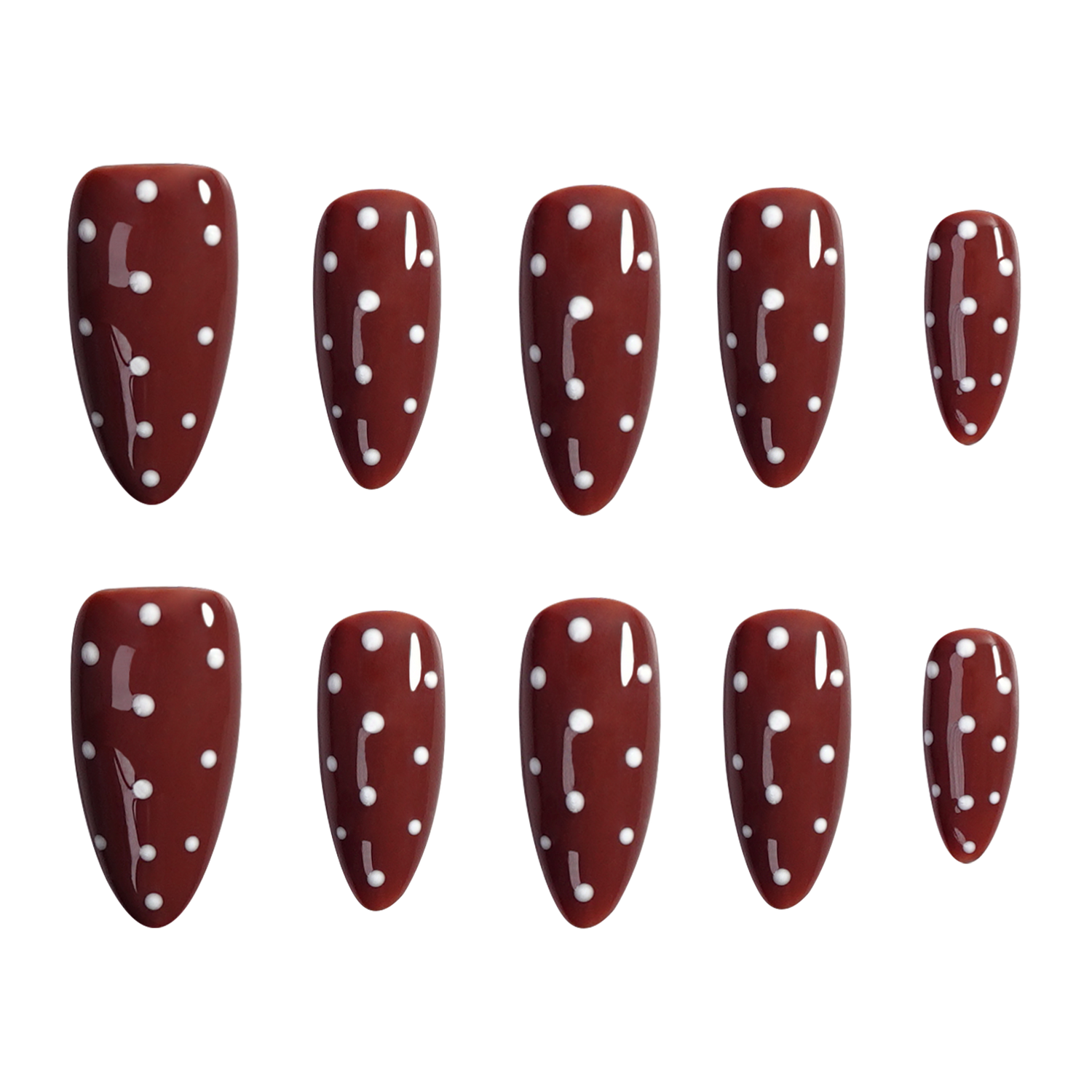 Ten almond-shaped press-on nails with a glossy dark red/burgundy base and white polka dots, arranged in two rows of five on a plain white background.