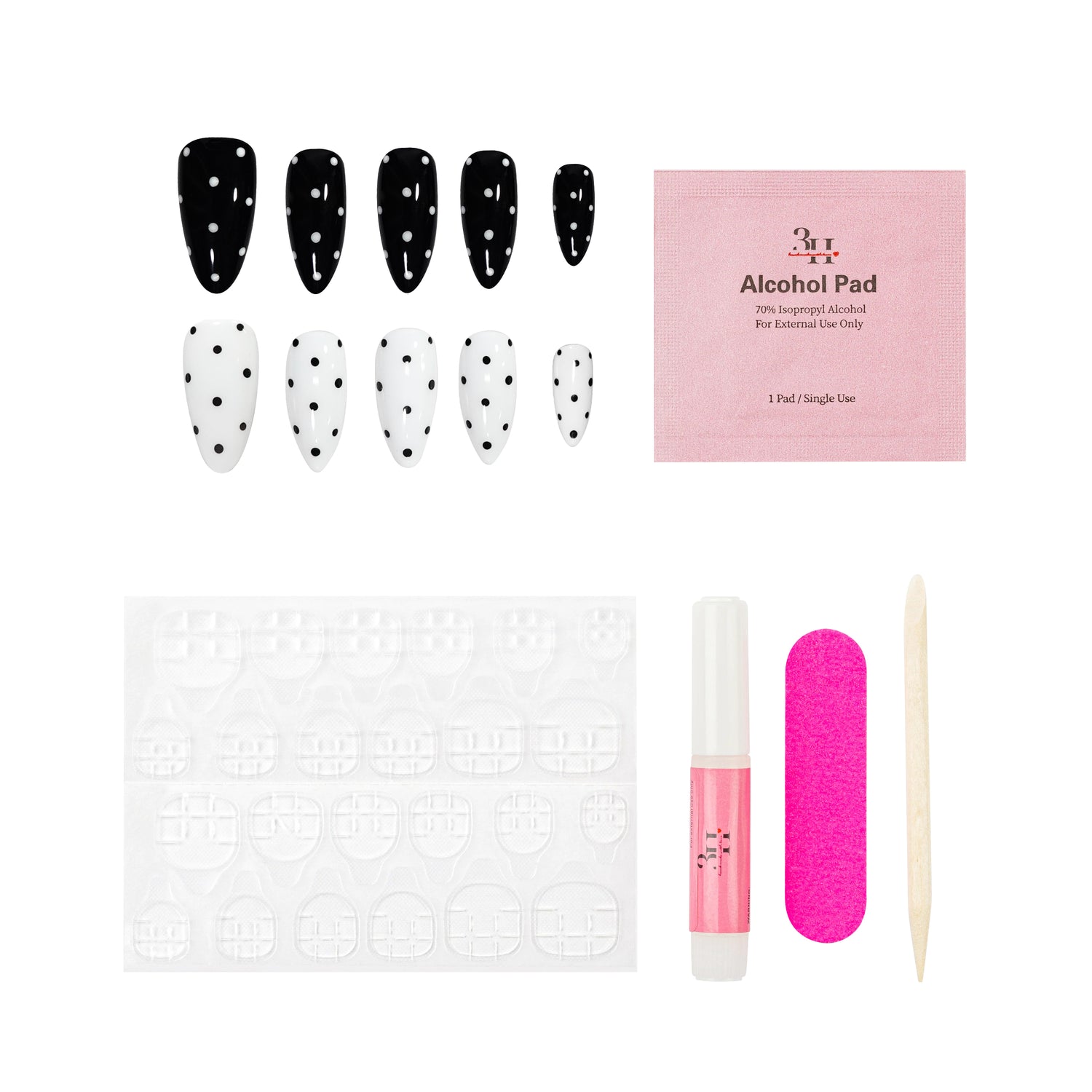 Nail art kit with false nails, alcohol pad, and tools on a white background