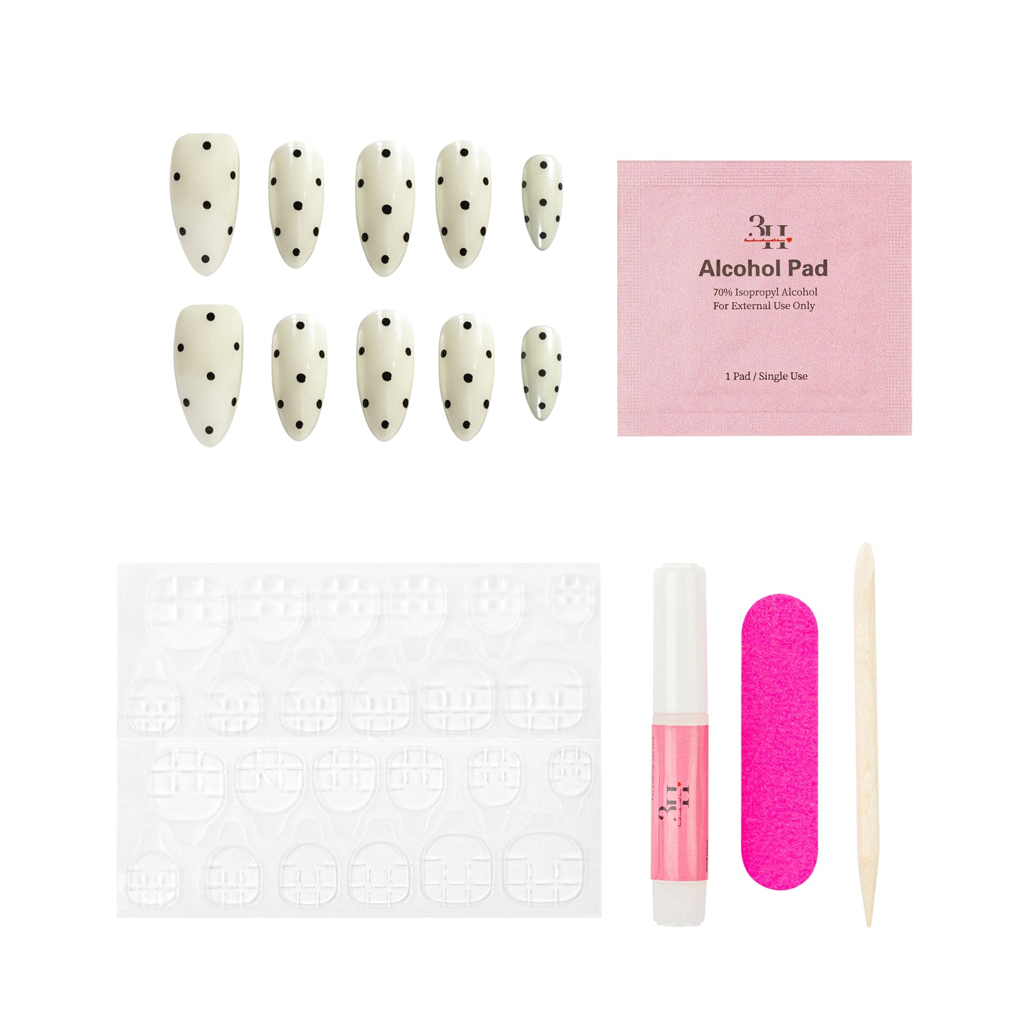 Nail art kit with nail extensions, alcohol pad, and tools on a white background