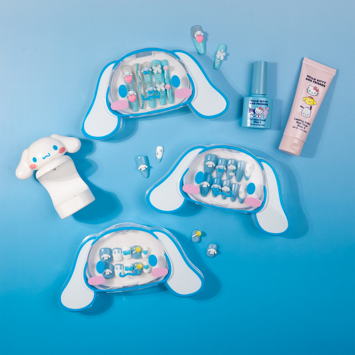 Three Cinnamoroll press-on nail designs in blue and white character-shaped cases