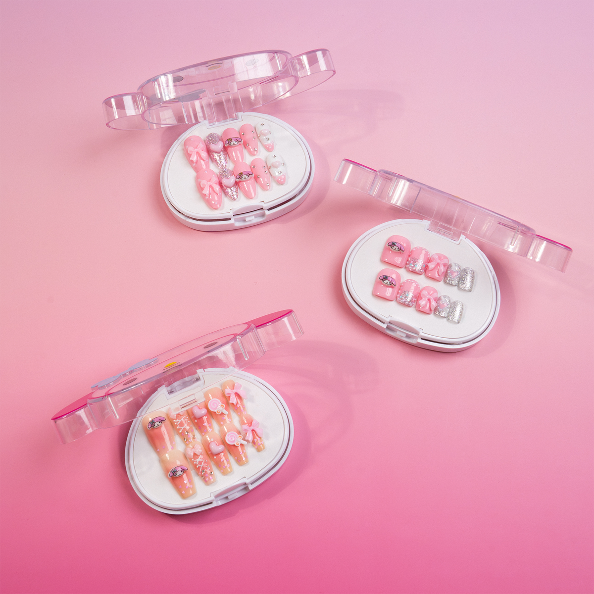 Three My Melody press-on nail designs in pink and white character-shaped cases