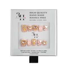 A 3H brand reusable luxury press-on nail kit in its original packaging, featuring 10 pink and gold decorative nails with rhinestones, displayed on a clean white background.