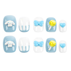 A set of ten decorative press-on nails arranged in two rows on a plain white background. The nails feature light blue and white candy-themed designs, including a Cinnamoroll cartoon character, bows, a lollipop, and a heart.