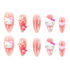 Ten pink press-on nails arranged in two rows on a white background, featuring Hello Kitty faces, pink stars, and heart designs.