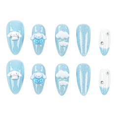 A set of ten press-on nails arranged in two rows of five on a plain white background. The nails feature a light blue and white theme with three cartoon character designs (Cinnamoroll), white clouds, glitter effects, and rhinestone accents.