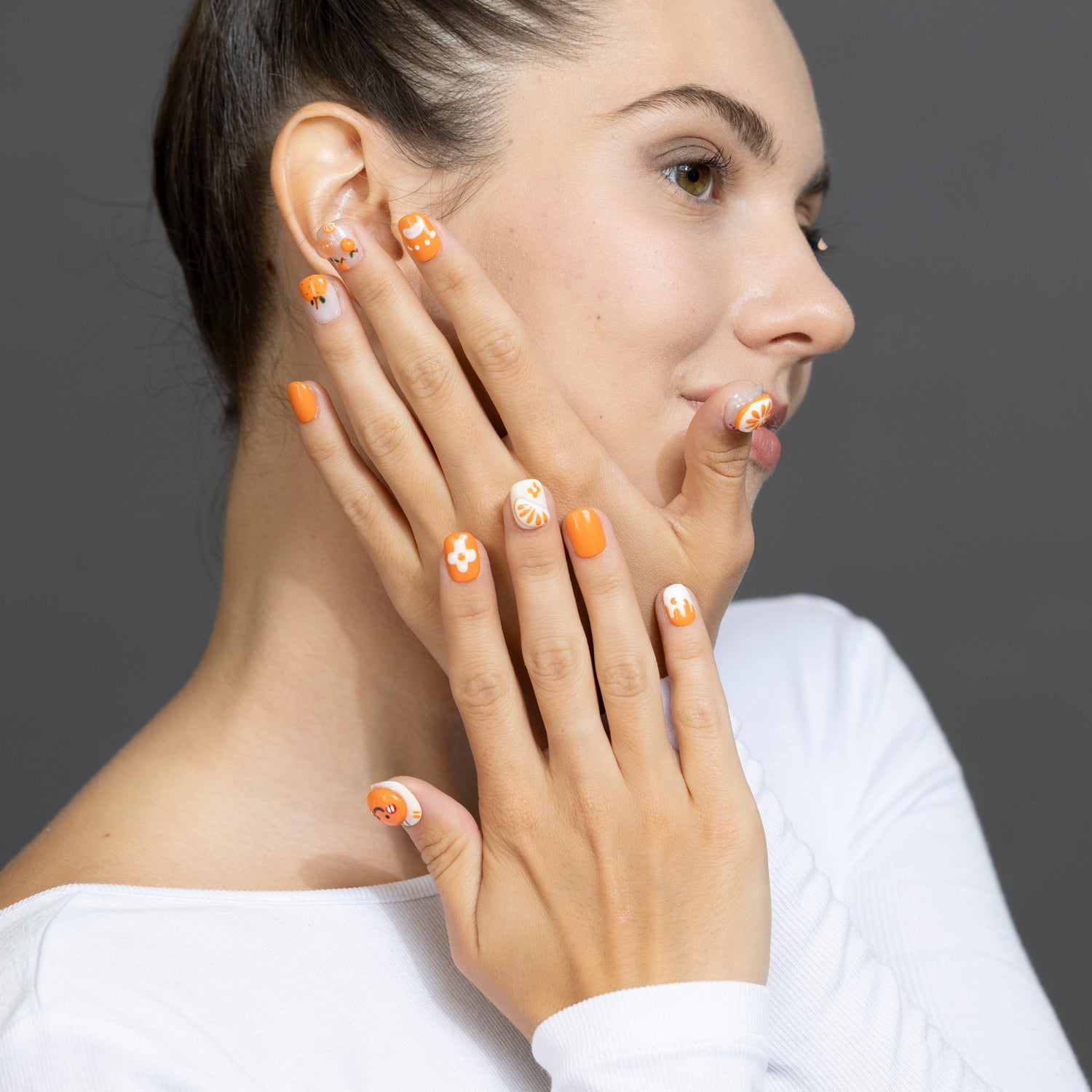 Handmade press-on nails by 3H Nails in a natural nude color, showcasing the elegant 1434 design on a model's hand.