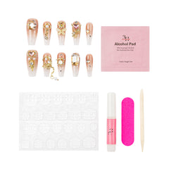 Nail art kit with decorative false nails, a pink alcohol pad packet, a white nail stamping plate, a pink nail file, a pink nail polish tube, and a wooden cuticle stick on a white background.