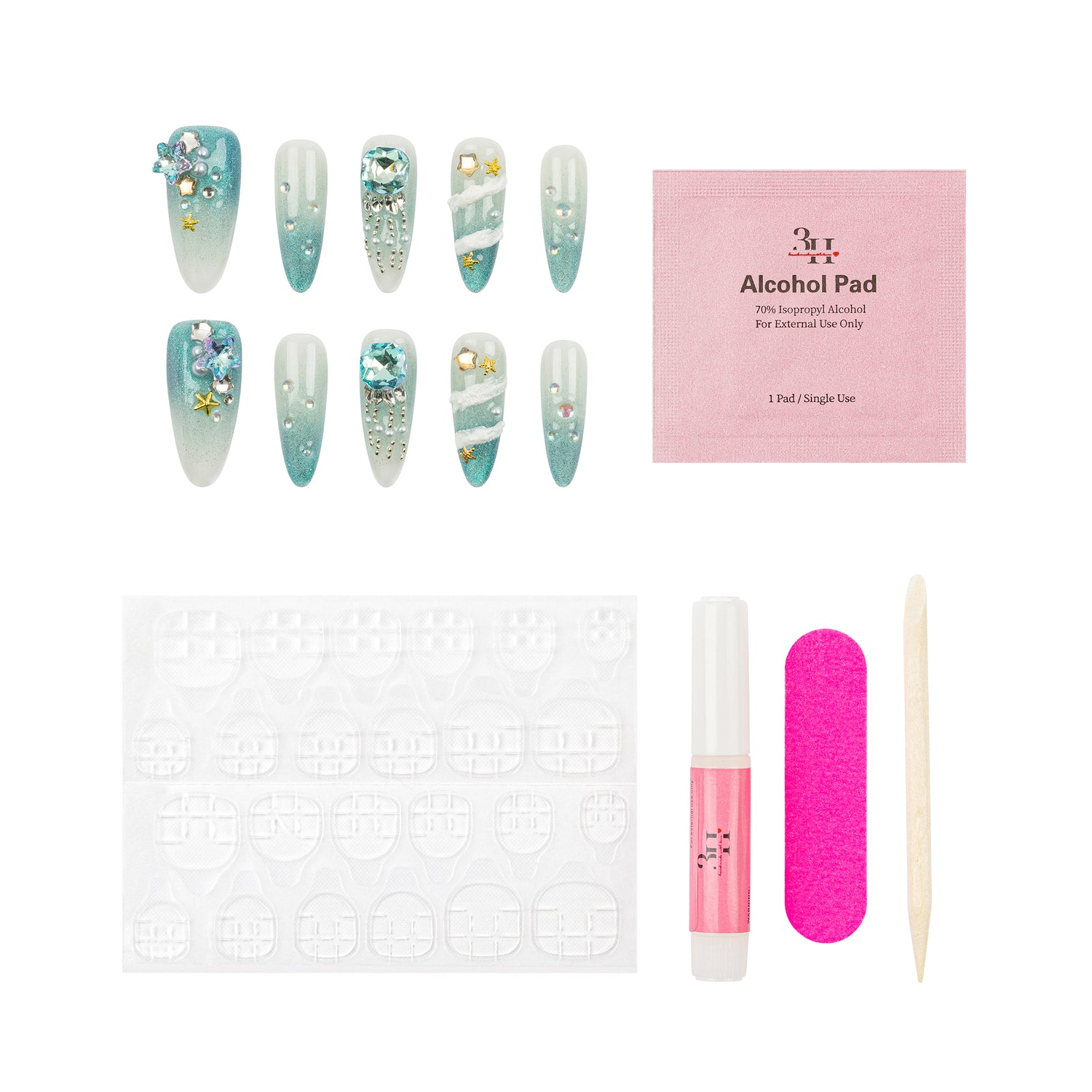 Nail art kit with six decorated false nails, a pink alcohol pad, a white stamping plate, a pink nail file, a pink nail polish bottle, and a wooden cuticle stick on a white background.