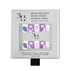 A 3H brand press-on nail kit in its original packaging, featuring white, purple, and lavender designs with grape and heart motifs.