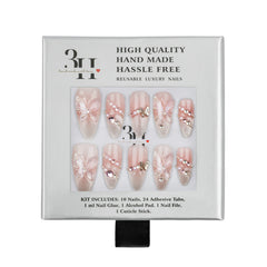 A 3H brand press-on nail kit in its original white packaging, featuring 10 decorative false nails with pink and white butterfly designs and rhinestone embellishments.