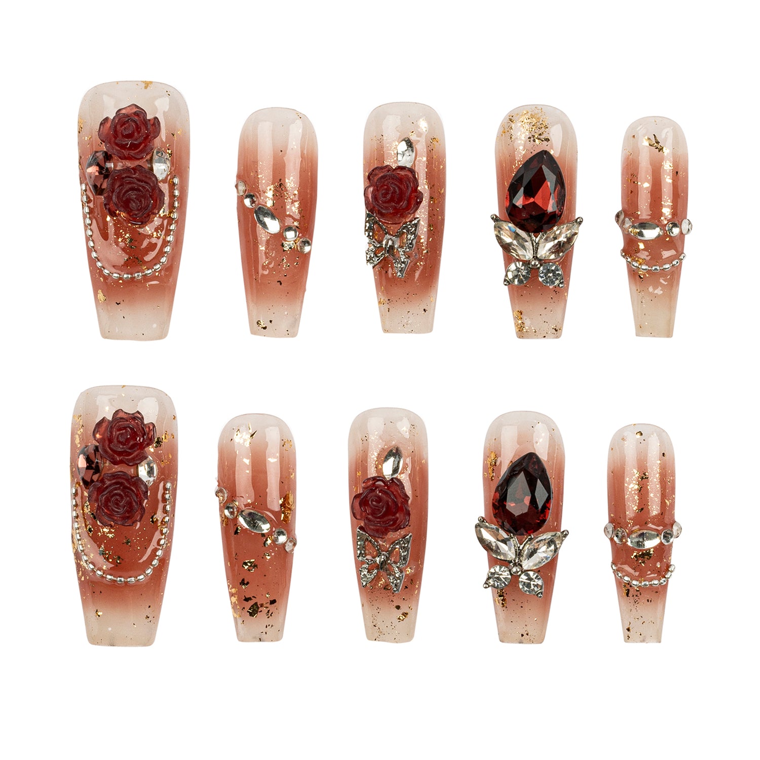 A set of ten coffin-shaped press-on nails with a pink ombre gradient, decorated with red roses, silver chains, pearls, and gold glitter, arranged in two rows on a white background.