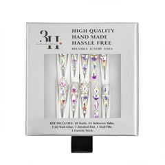 A boxed set of reusable luxury nail tips with iridescent rhinestone designs, shown in its retail packaging against a white background.