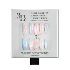 A 10-piece set of reusable press-on nails in a light gray packaging box. The nails feature pastel designs including pink bows, floral patterns, and delicate line art on a white base.