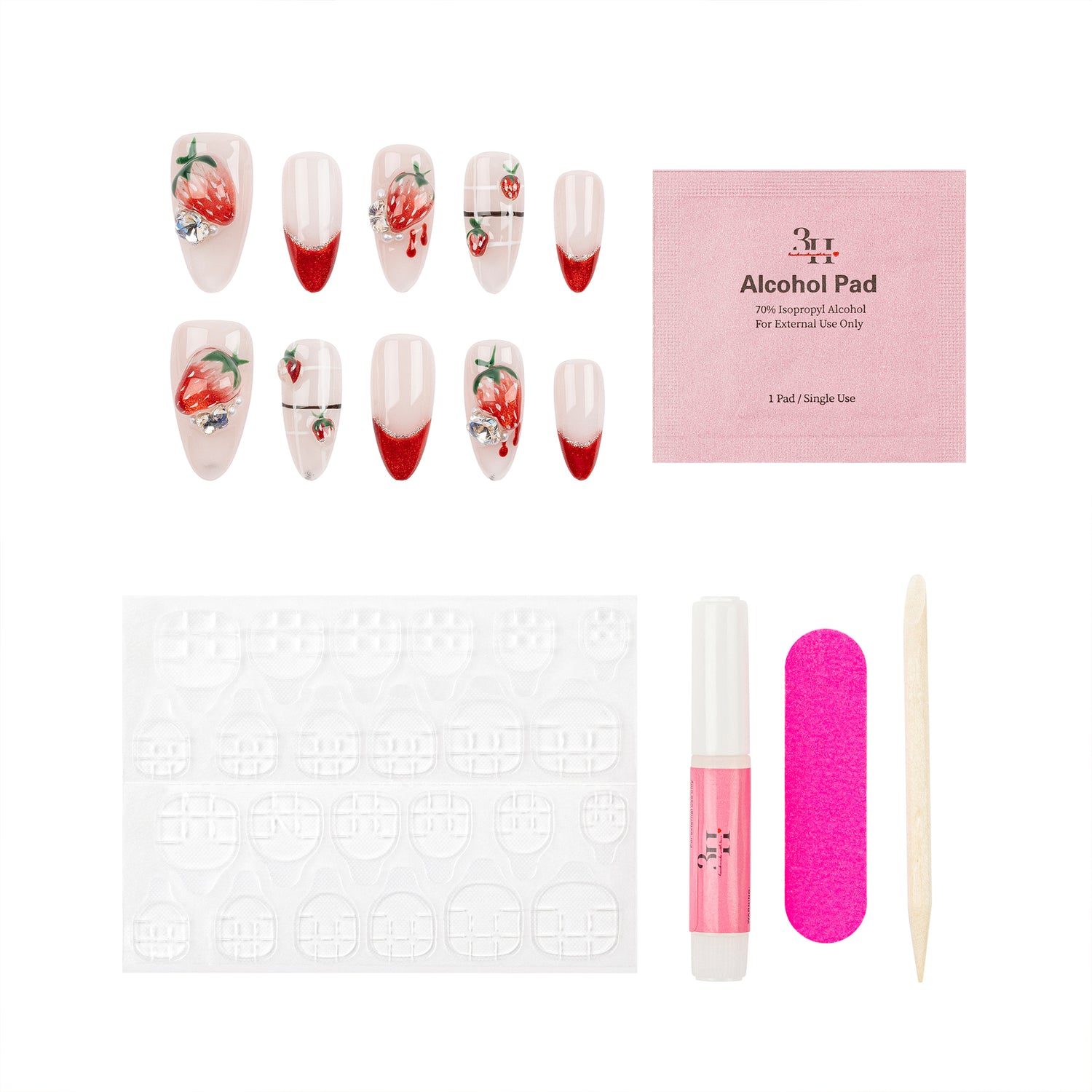 Nail art kit with false nails decorated with strawberry designs and red gradient tips, a pink packet labeled 'Alcohol Pad', adhesive tabs, a pink alcohol pad tube, a bright pink nail file, and a wooden cuticle stick on a white background.
