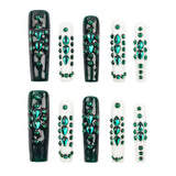 Ten coffin-shaped press-on nails arranged in two rows of five on a plain white background. The nails feature glossy black and white bases decorated with multiple rows of sparkling green rhinestones.