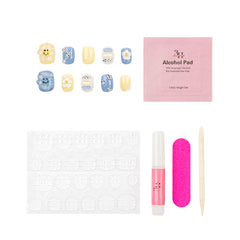 Nail art kit with a set of decorative false nails in pastel yellow, blue, and white, a pink packet of alcohol pads, adhesive tabs, a pink nail file, a pink nail polish tube, and a wooden cuticle stick on a white background.