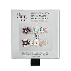 A 3H brand reusable luxury press-on nail kit in its original packaging, featuring two sets of decorative nails with cat-eye designs, zebra prints, and pastel accents.