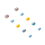 Handmade press-on nails in a natural pink and white design with intricate detailing, by 3H Nails.