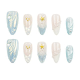 Ten artificial press-on nails arranged in two rows on a plain white background. The nails feature a mix of designs: light blue and white marbled patterns, white pearl bead details, and two gold starfish accents.