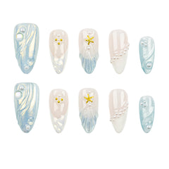 Ten artificial press-on nails arranged in two rows on a plain white background. The nails feature a mix of designs: light blue and white marbled patterns, white pearl bead details, and two gold starfish accents.