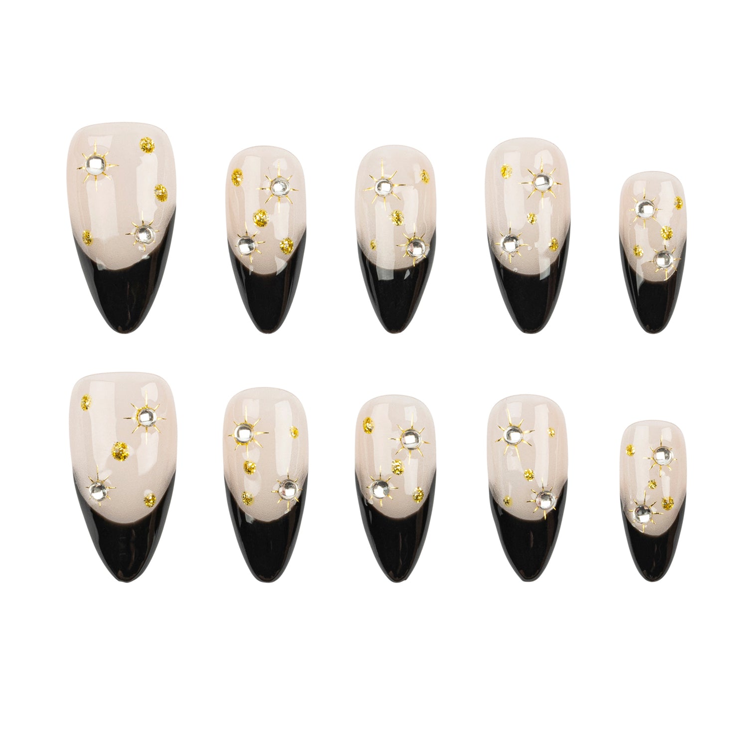 Ten false press-on nails arranged in two rows on a plain white background. Each nail has a glossy black pointed toe and a pale blush-beige upper section decorated with small gold foil flakes and rhinestone clusters.