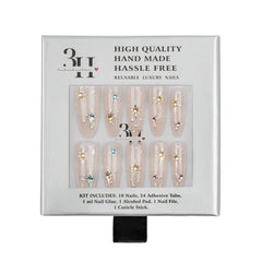 A 3H brand press-on nail kit in its original white packaging, featuring 10 long coffin-shaped nails decorated with gold, blue, and pink rhinestones. The packaging text highlights 'High Quality Hand Made Hassle Free Reusable Luxury Nails'.