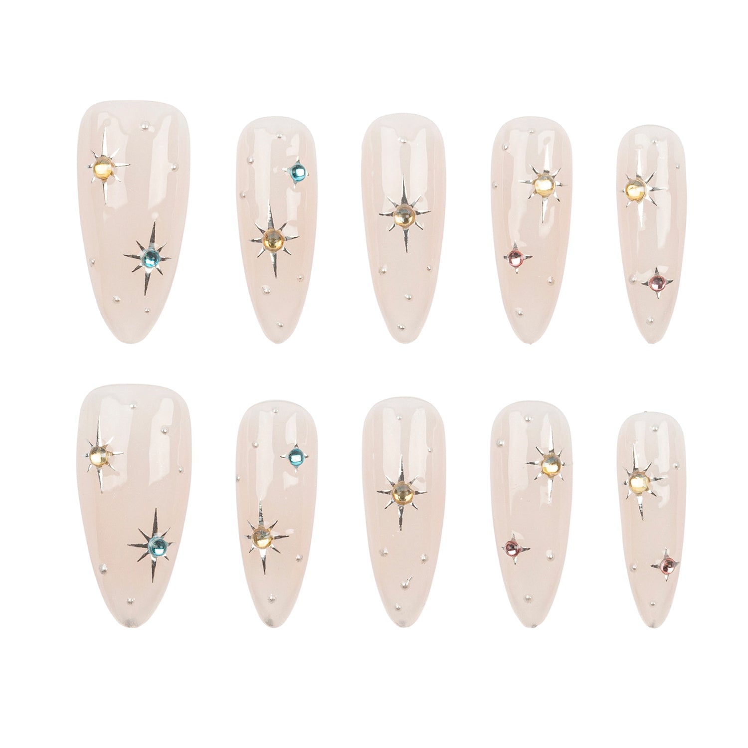 Ten almond-shaped press-on nails arranged in two rows of five on a plain white background. Each nail has a glossy pale blush pink base with small scattered rhinestones and a few starburst accents in gold, silver, blue, and pink.