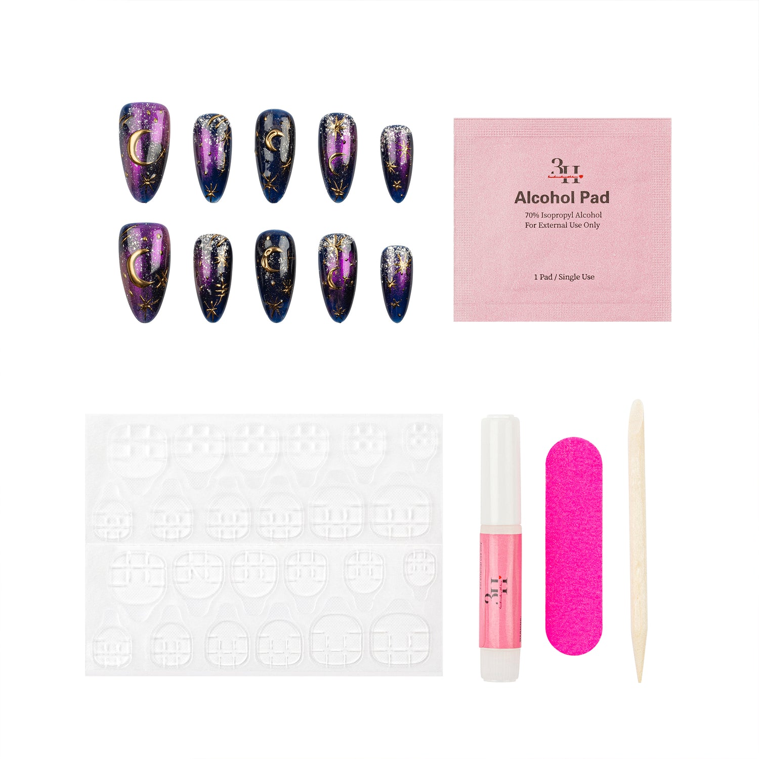 A nail art kit on a white background featuring ten false nails with a purple and black celestial pattern, a pink packet of gel nail polish, adhesive tabs, a pink nail file, a pink nail glue tube, and a wooden cuticle stick.