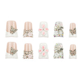 Ten decorative press-on nails arranged in two rows on a plain white background. The set includes nude pink and white nails embellished with rhinestone butterflies, pearl bead wraps, pink flower centers, and clear rhinestone clusters.