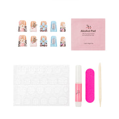 Nail art kit with false press-on nails, a pink packet of alcohol pads, adhesive tabs, a pink nail file, a pink nail polish tube, and a wooden cuticle stick on a white background.
