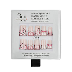 A 10-piece press-on nail kit in its original gray packaging, featuring leopard print, pink zebra and glittery pink designs on the nails.