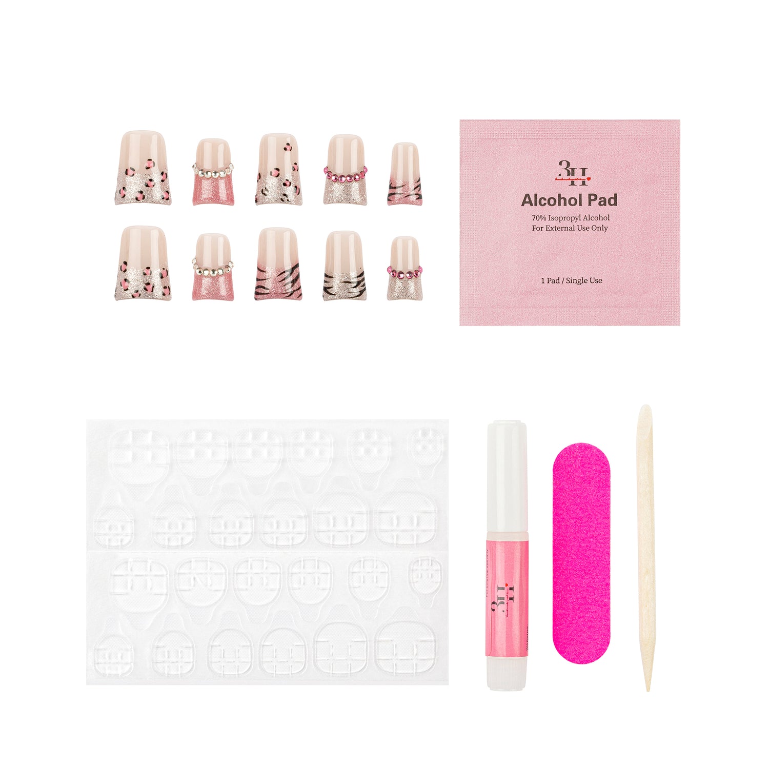 Nail art kit with decorative false nails, a pink packet of alcohol pads, a pink nail file, a pink nail glue tube, and a wooden stick tool on a white background.