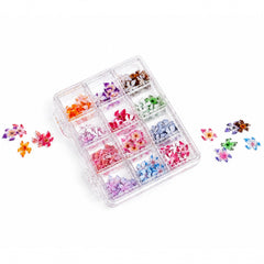 Assorted Orchid Blossom nail charms by 3H Nails displayed in a case, featuring delicate floral designs for nail art.