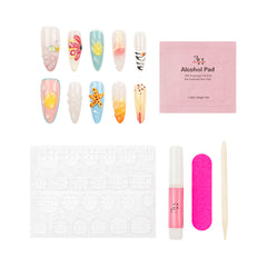 Nail art kit with decorative nail sample tips, a pink Alcohol Pad, adhesive tabs, a pink nail glue tube, A cuticle stick, and a pink nail file on a white background.