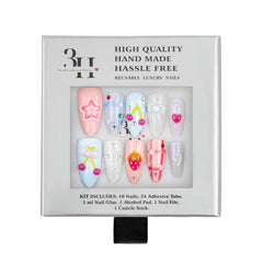 A boxed set of decorative press-on nails in a gray retail package. The front window shows ten almond-shaped nails in pastel colors with floral, bow, and heart designs.