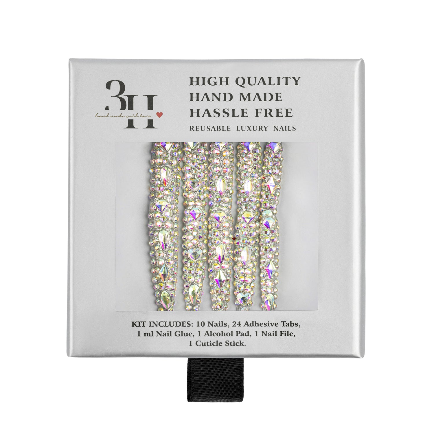 A boxed set of reusable luxury nail tips with rhinestone-embellished nails visible through a clear window on a white background. The packaging reads 'HIGH QUALITY HAND MADE HASSLE FREE' and includes a black ribbon at the bottom.
