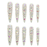 Ten long stiletto-shaped nail tips decorated with dense iridescent rhinestones, arranged in two rows of five on a plain white background.