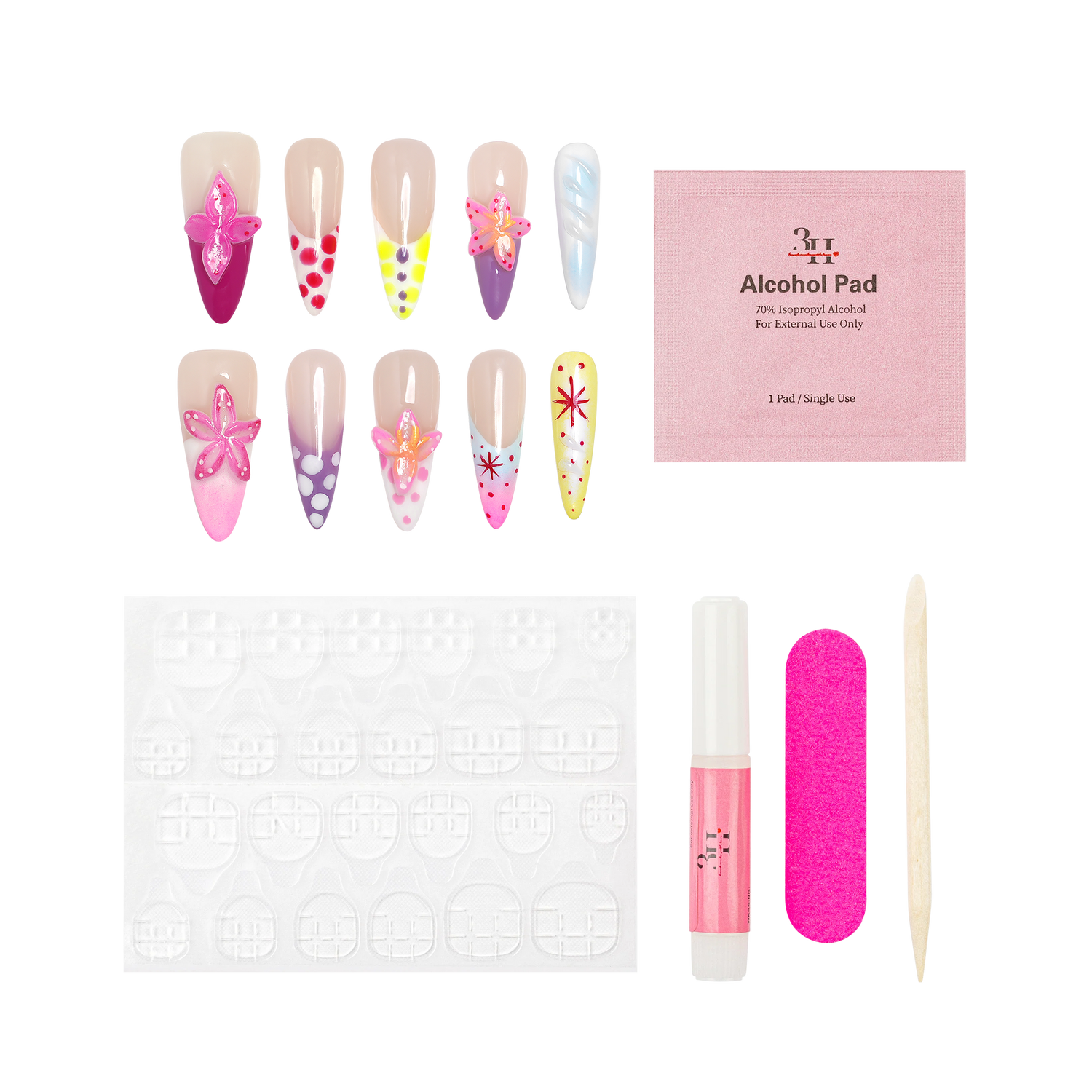Nail art kit with decorative false nails, a pink alcohol pad packet, adhesive tabs, a pink nail file, a pink nail glue tube, and a wooden tool on a white background.