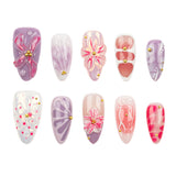 Ten almond-shaped press-on nails arranged in two rows of five on a plain white background. The nails feature pastel lavender, pink, and white marbled designs with floral motifs, abstract line patterns, and small gold metallic accents.