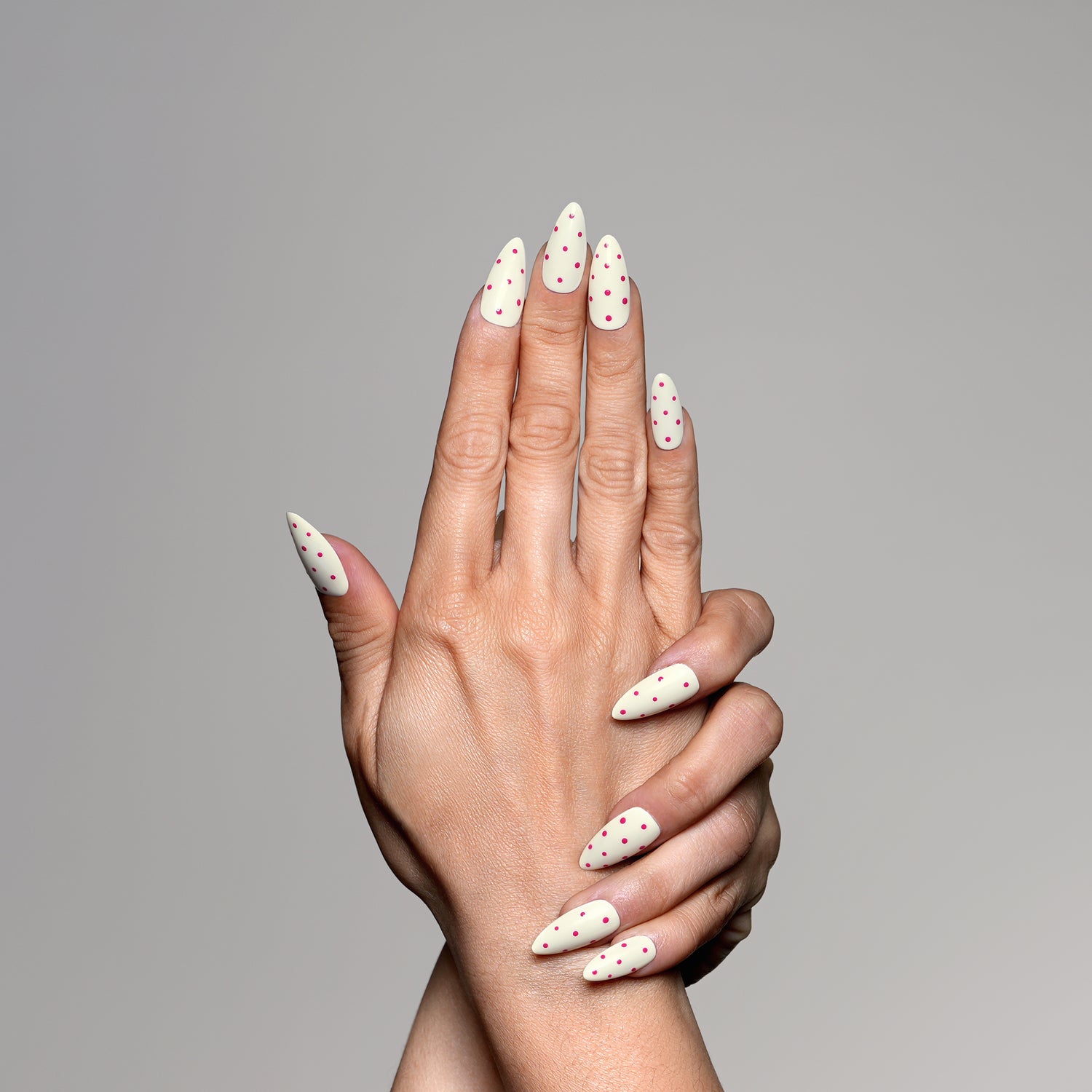 Hand model showing 3H Nails Luxury Handmade Press-on Nails in Flamingo Pop design on natural nails.