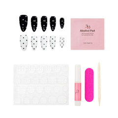 Nail art kit with false nails, alcohol pad, and tools on a white background