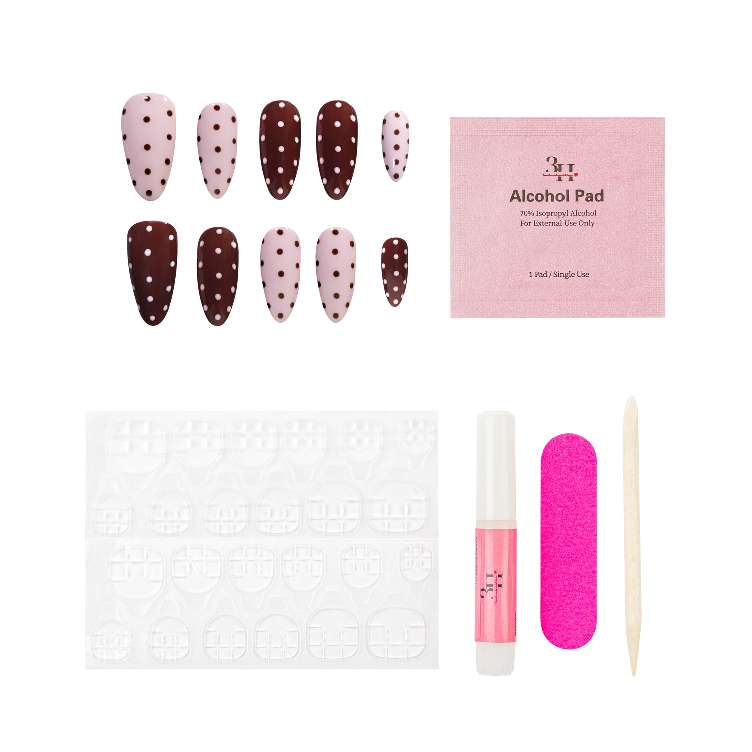 Nail art kit with nail extensions, alcohol pad, and other tools on a white background