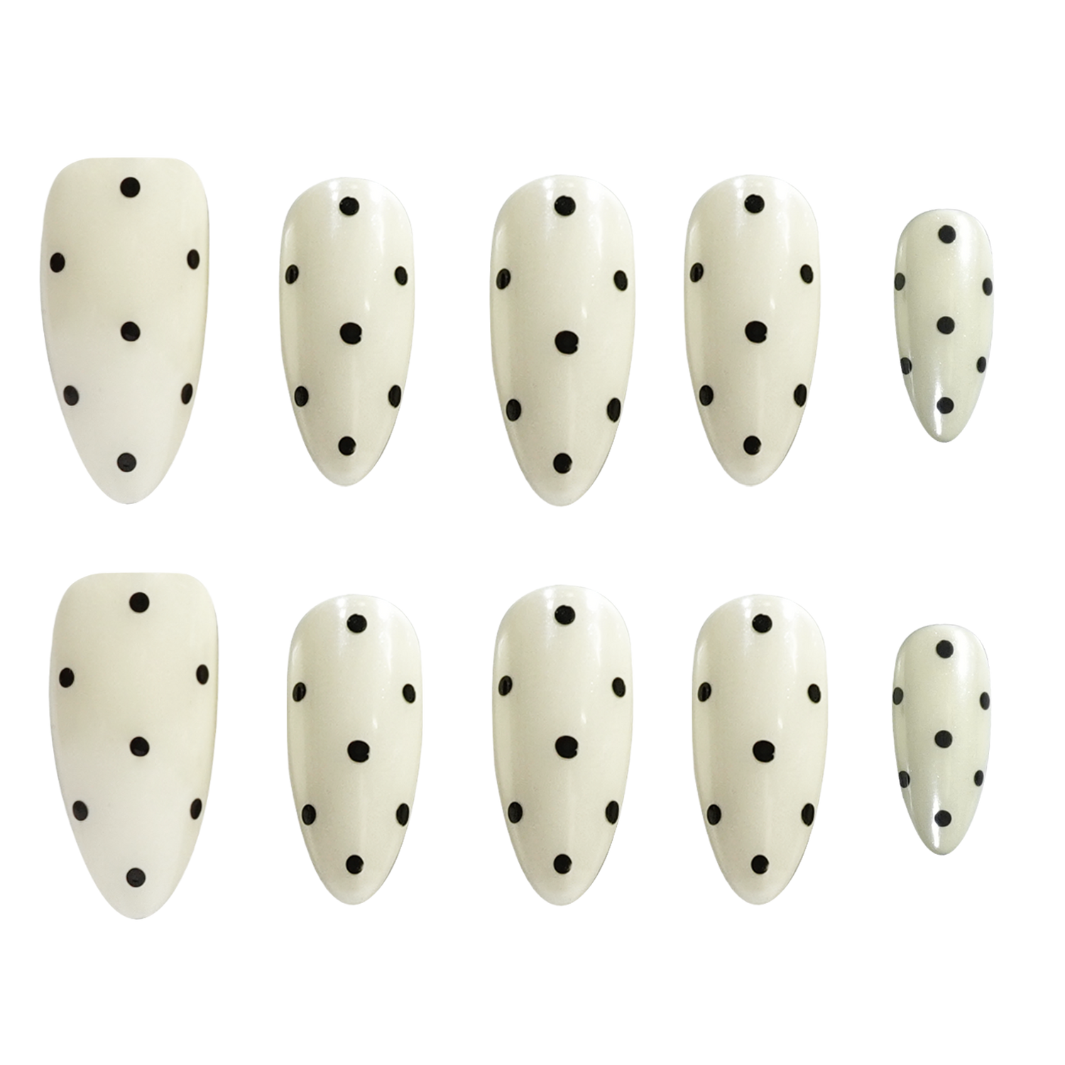 Ten almond-shaped press-on nails with a glossy off-white finish and black polka dots, arranged in two rows of five on a plain white background.