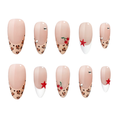 Atlanta medium almond press-on nails by 3H Nails, featuring a nude base with leopard-print tips, white French accents, red stars, cherries, and rhinestones.