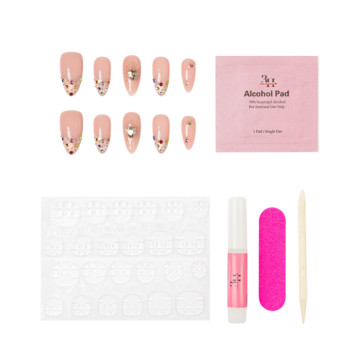 Boston medium almond press-on nails by 3H Nails, featuring a nude base with champagne glitter, multicolor gems, metallic accents, and heart details, shown with the included application kit.