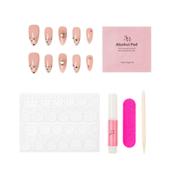 Boston medium almond press-on nails by 3H Nails, featuring a nude base with champagne glitter, multicolor gems, metallic accents, and heart details, shown with the included application kit.